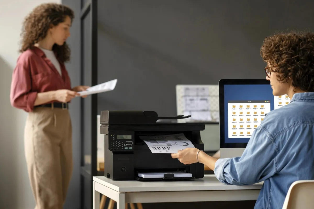 Prepress experts checking a color proof on press